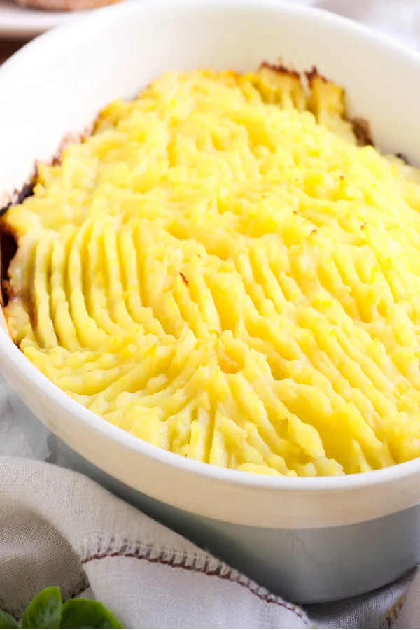 mashed potatoes on top of a casserole