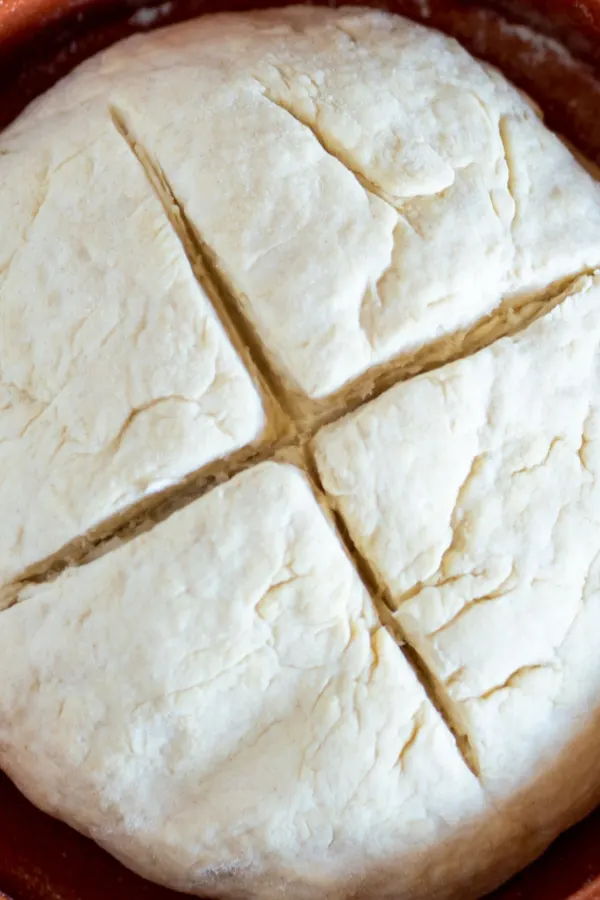 bread dough with criss cross cut on top