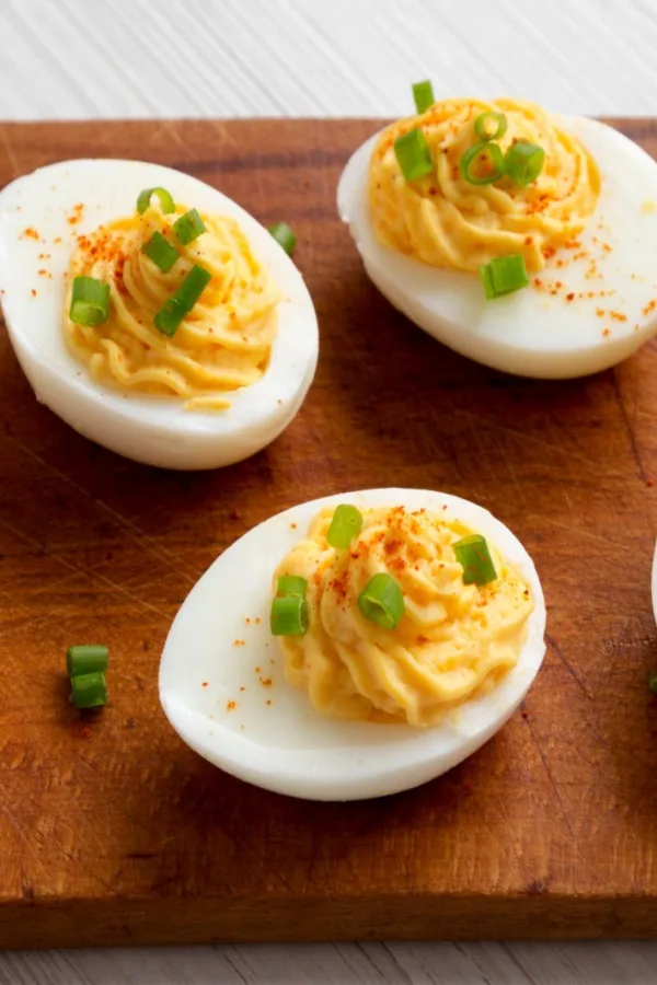 The Best Deviled Eggs garnished with chives and paprika