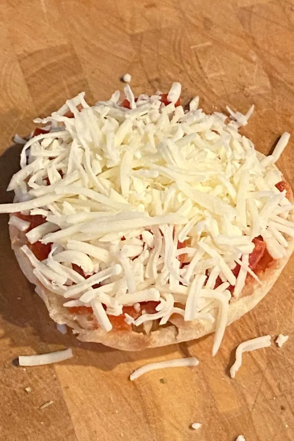 shredded cheese on bread