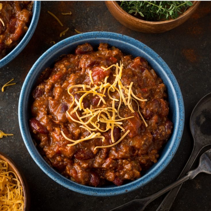 pumpkin chili with shredded cheese on top