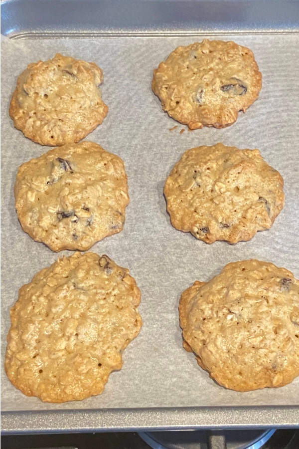 baked oatmeal raisin cookies on cookie sheet