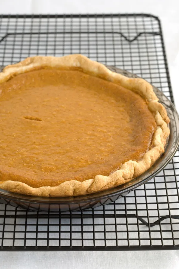 pumpkin pie on cooling rack