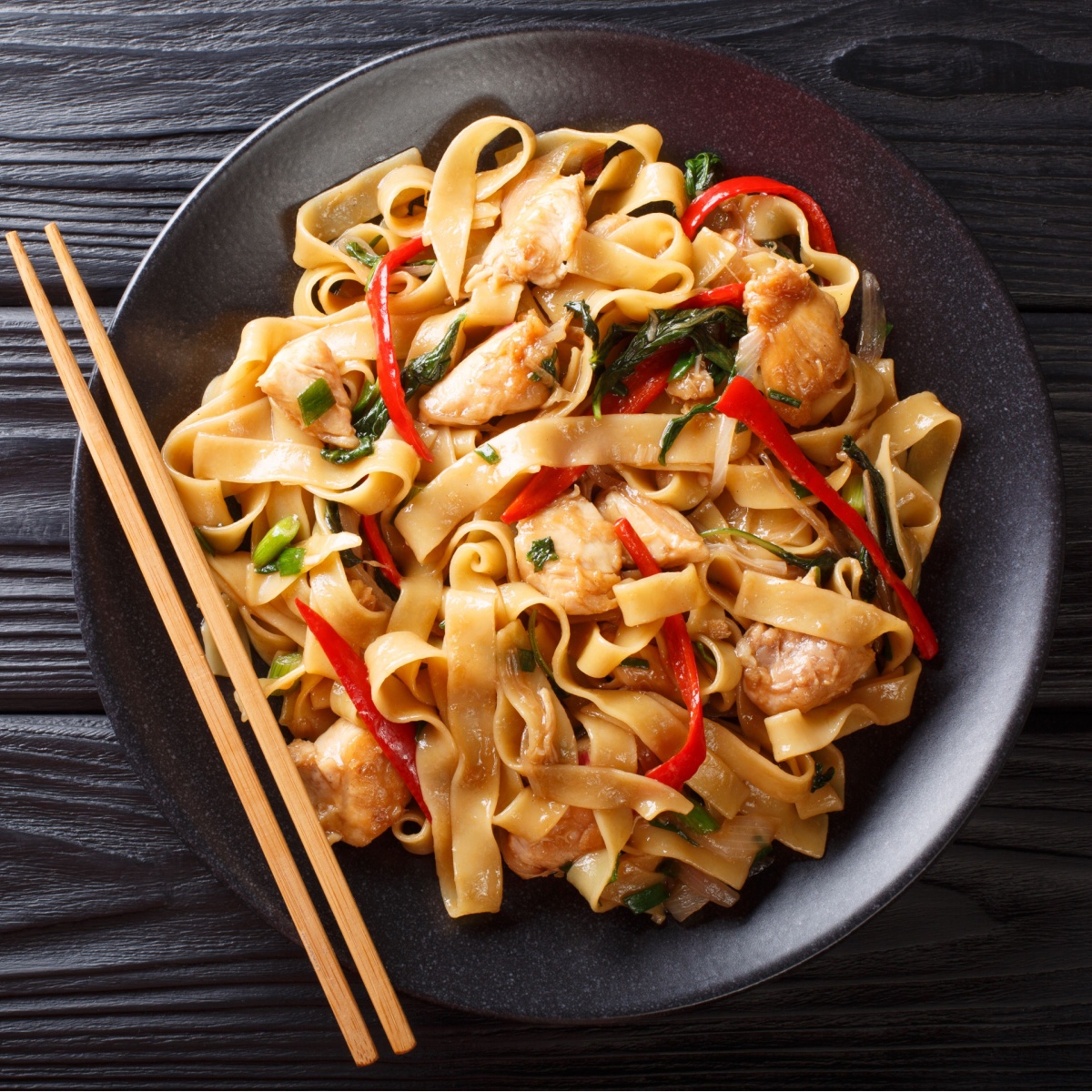 Drunken Noodles on black plate