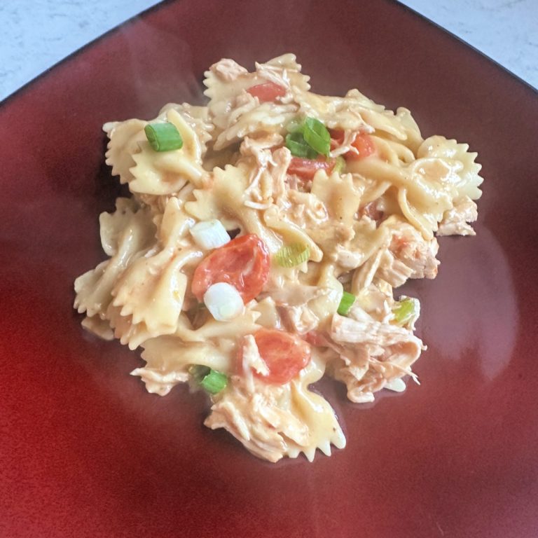 barbecue chicken and cheese pasta dinner on plate