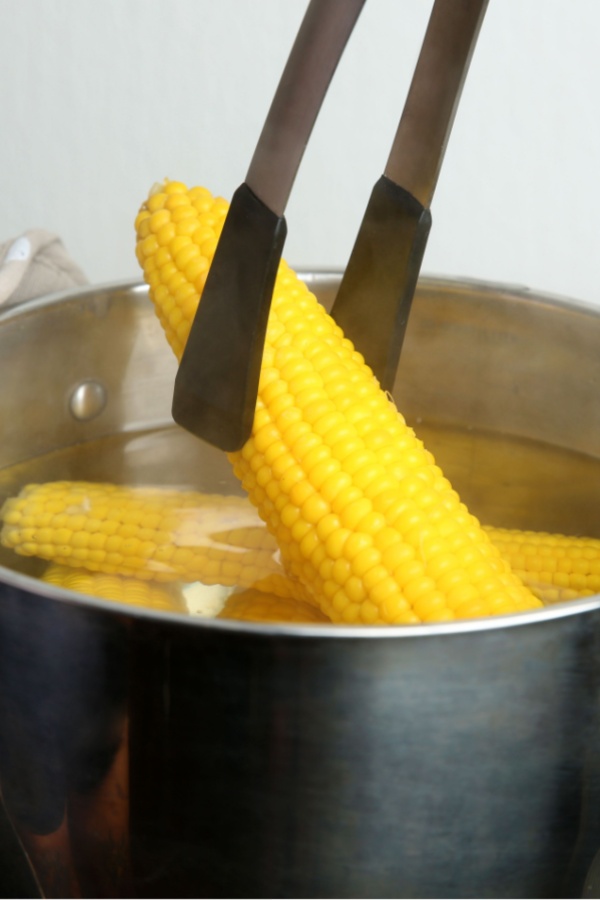 corn on the cob coming out of pot