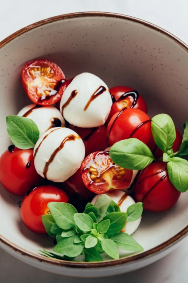 caprese salad with cherry tomatoes and balsamic vinegar