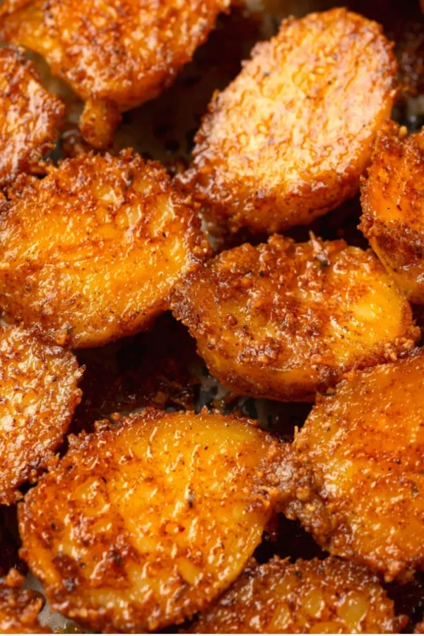 parmesan crusted potatoes on sheet pan
