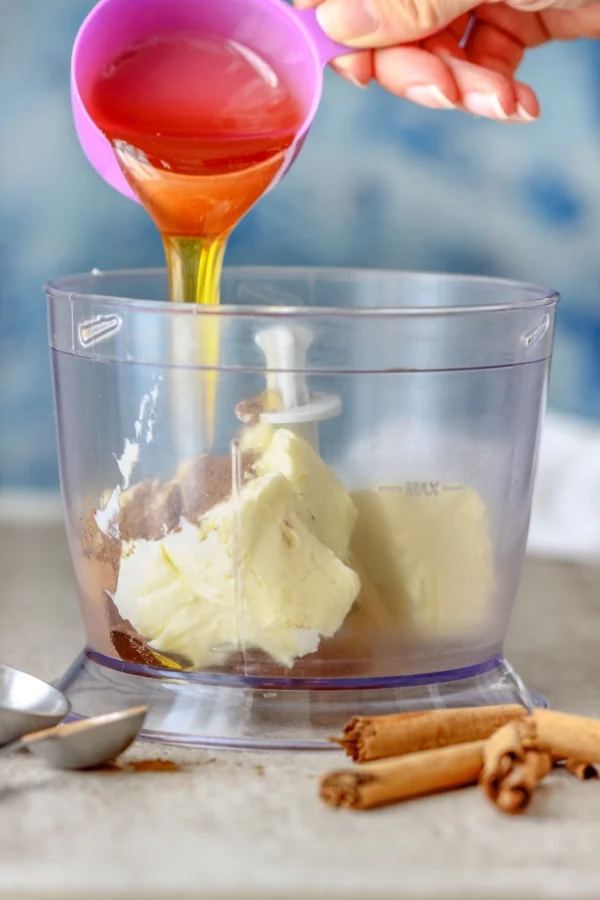 pouring honey in food processor