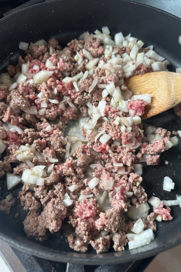 ground beef and onions in skillet