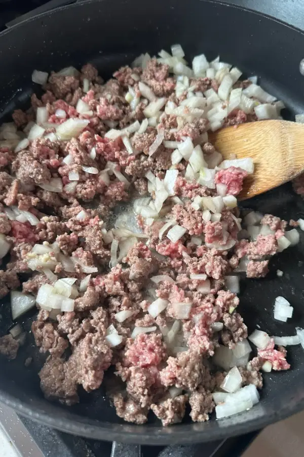 ground beef and onions in skillet