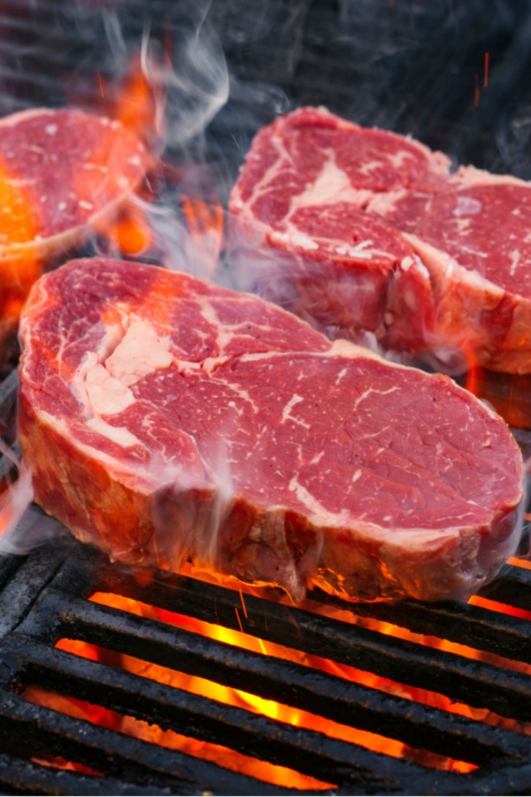 steaks on hot grill